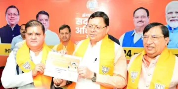 धामी ने बीजेपी के प्रथम सदस्य के रूप में सदस्यता ग्रहण की